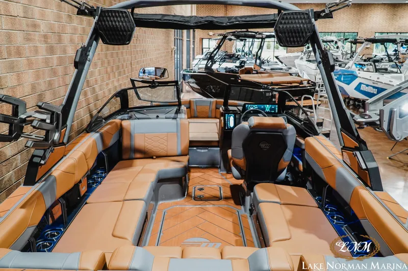 Slide: The Image of 2026 Malibu Wakesetter 23 LSV interior with luxurious seating at Lake Norman Marina. - 8