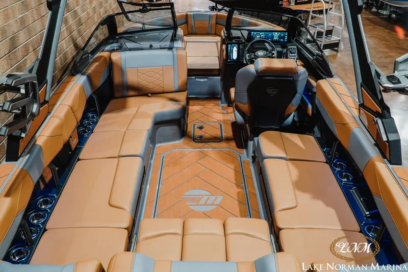 Slide: The Image of 2026 Malibu Wakesetter 23 LSV interior with luxurious tan and gray seating. - 9