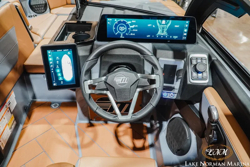 Slide: The Image of 2026 Malibu Wakesetter 23 LSV dashboard with advanced digital displays and modern steering wheel. - 15