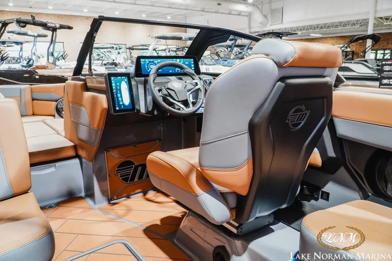 Slide: The Image of 2026 Malibu Wakesetter 23 LSV interior with modern dashboard and leather seating. - 14