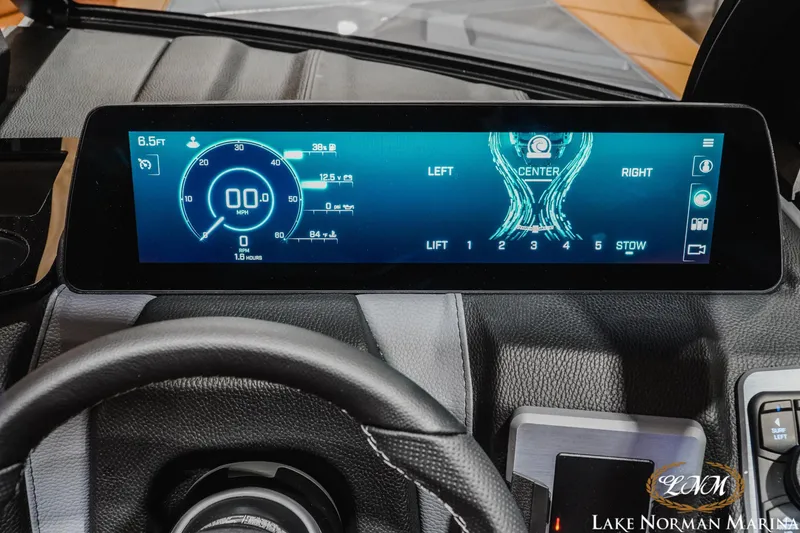 Slide: The Image of 2026 Malibu Wakesetter 23 LSV dashboard display with digital speedometer and control settings. - 16
