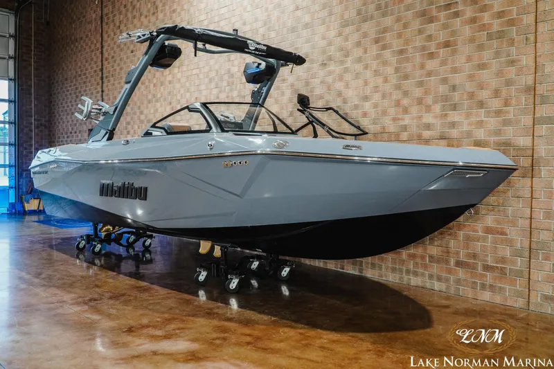 Slide: The Image of 2026 Malibu Wakesetter 23 LSV boat displayed indoors at Lake Norman Marina. - 3