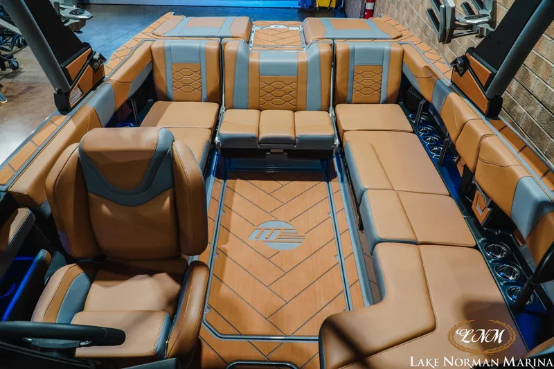 Slide: The Image of Luxurious interior of 2026 Malibu Wakesetter 23 LSV boat with brown leather seating. - 20