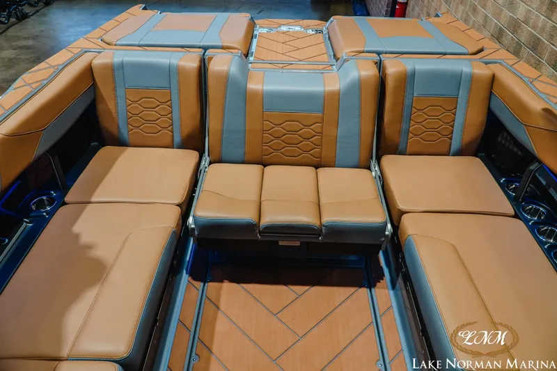 Slide: The Image of 2026 Malibu Wakesetter 23 LSV interior with luxurious tan and gray seating. - 21