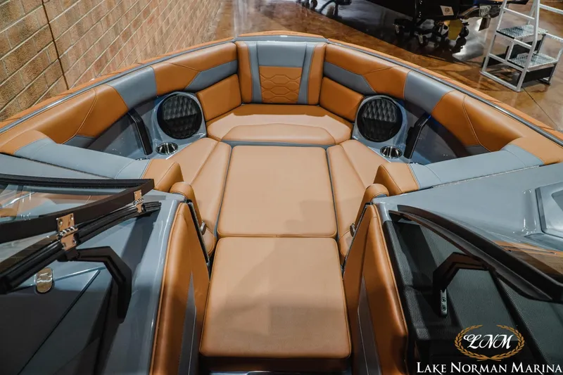 Slide: The Image of Luxurious interior of 2026 Malibu Wakesetter 23 LSV boat with tan and gray seating. - 18