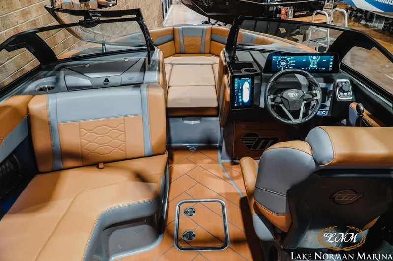 Slide: The Image of 2026 Malibu Wakesetter 23 LSV interior with modern dashboard and luxurious seating. - 13