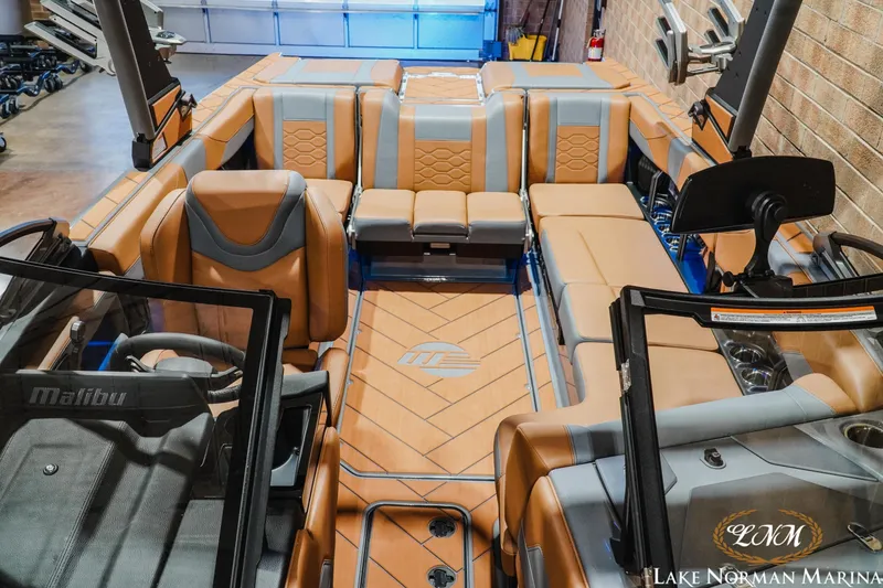 Slide: The Image of 2026 Malibu Wakesetter 23 LSV interior with luxurious tan and gray seating. - 19