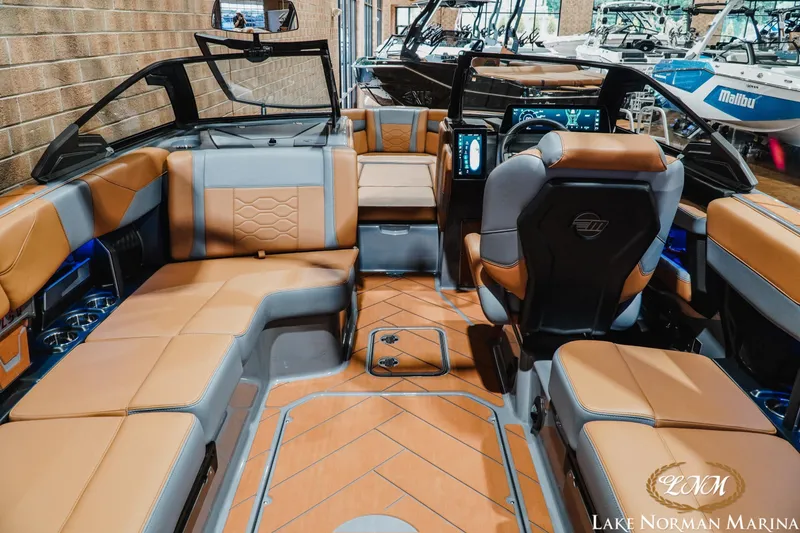Slide: The Image of 2026 Malibu Wakesetter 23 LSV interior with luxurious seating and modern dashboard at Lake Norman Marina. - 10