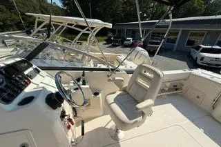 Slide: The Image of 2015 Grady-White Freedom 225 boat interior with steering wheel and seating. - 7