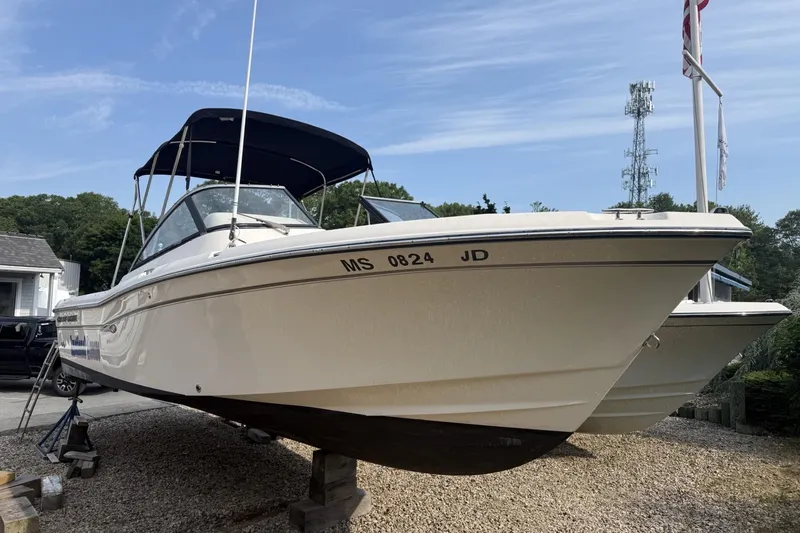 The Image of 2015 Grady-White Freedom 225 boat on display, parked on gravel. - 1