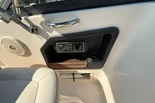 Slide: The Image of 2015 Grady-White Freedom 225 boat interior with control panel and speaker. - 20