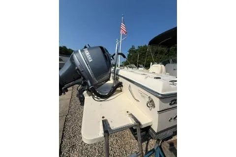 Slide: The Image of 2015 Grady-White Freedom 225 boat with Yamaha outboard motor and American flag. - 33