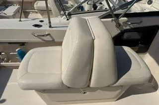 Slide: The Image of 2015 Grady-White Freedom 225 boat seat, white upholstery, sleek design. - 25