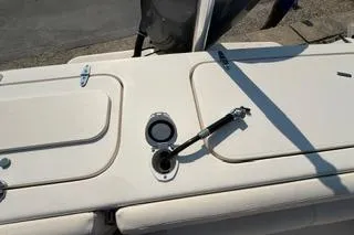 Slide: The Image of 2015 Grady-White Freedom 225 boat deck with open hatch and hydraulic support. - 23