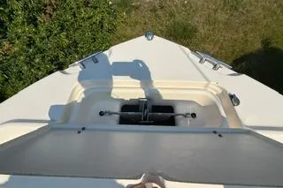 Slide: The Image of 2015 Grady-White Freedom 225 boat bow with anchor storage, viewed from above. - 15
