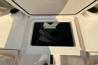 Slide: The Image of 2015 Grady-White Freedom 225 boat storage compartment, open and empty. - 29