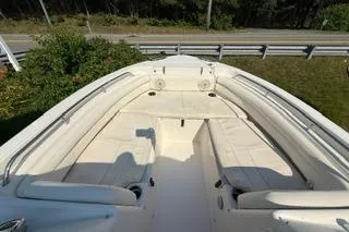 Slide: The Image of 2015 Grady-White Freedom 225 boat with spacious seating and sleek design. - 14