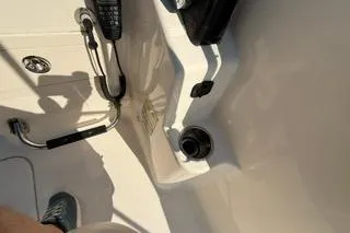 Slide: The Image of 2015 Grady-White Freedom 225 boat interior with control panel and radio equipment. - 12