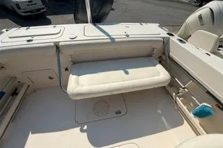 Slide: The Image of 2015 Grady-White Freedom 225 boat interior with foldable seating and storage compartments. - 27