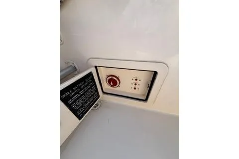 Slide: The Image of 2015 Grady-White Freedom 225 boat control panel with battery switch and instructions. - 28