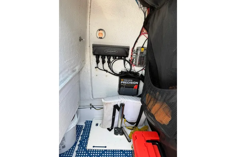 Slide: The Image of Electrical setup inside a 2017 Sportsman Open 232 Center Console boat, featuring Garmin equipment. - 41
