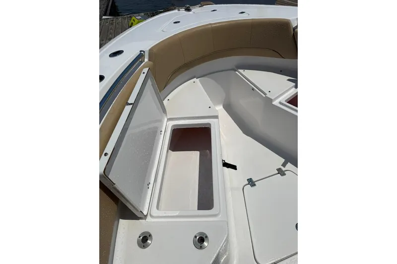 Slide: The Image of 2017 Sportsman Open 232 Center Console boat with open storage compartment. - 19