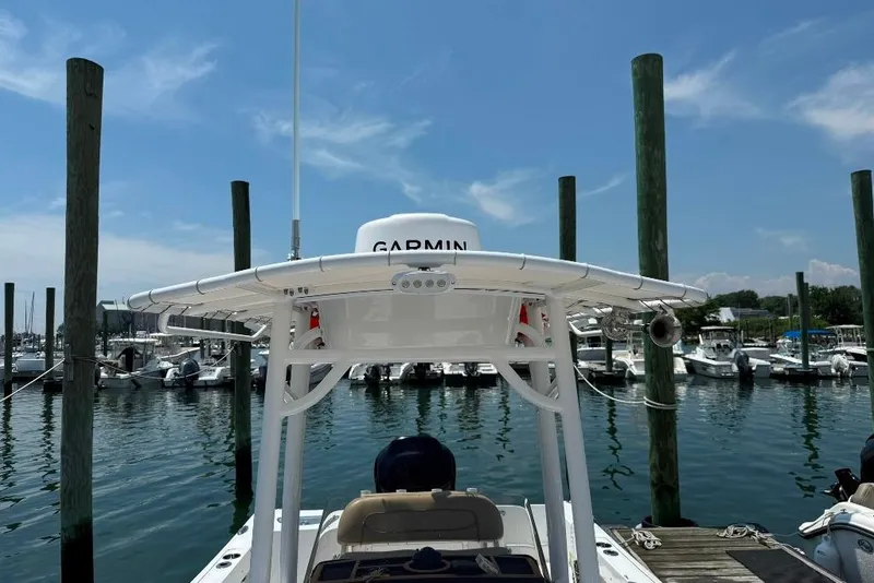 Slide: The Image of 2017 Sportsman Open 232 Center Console boat docked at marina with Garmin equipment. - 3
