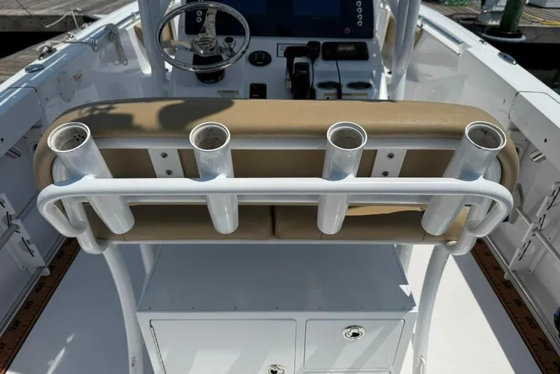 Slide: The Image of 2017 Sportsman Open 232 Center Console boat with rod holders and steering console. - 33