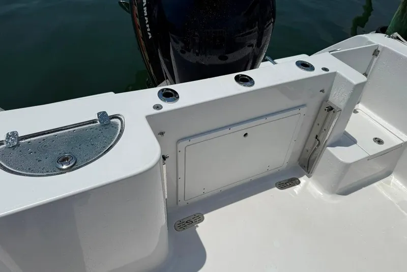 Slide: The Image of 2017 Sportsman Open 232 Center Console boat deck with storage and seating. - 34