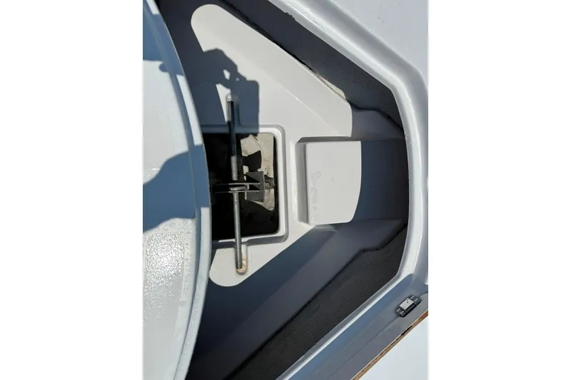 Slide: The Image of Anchor storage compartment on a 2017 Sportsman Open 232 Center Console boat. - 15