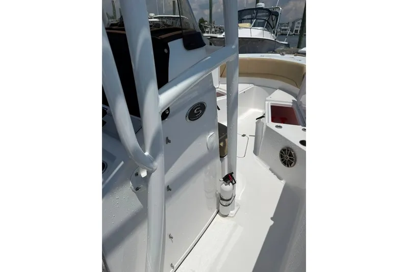 Slide: The Image of 2017 Sportsman Open 232 Center Console boat interior with seating and storage compartments. - 39