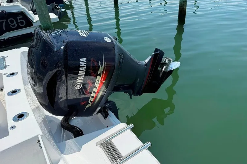 Slide: The Image of 2017 Sportsman Open 232 Center Console with Yamaha VMAX outboard motor in marina. - 11