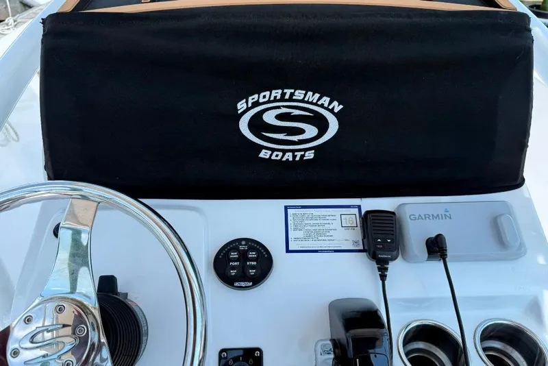 Slide: The Image of Console of a 2017 Sportsman Open 232 Center Console boat with Garmin equipment. - 38