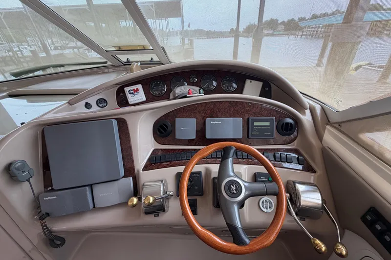 Slide: The Image of Helm of 2002 Sea Ray 480 Motor Yacht with steering wheel and navigation instruments. - 14