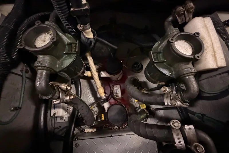 Slide: The Image of Engine room of a 2002 Sea Ray 480 Motor Yacht, showcasing complex piping and machinery. - 44