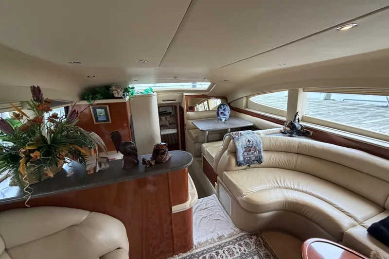 Slide: The Image of Luxurious interior of a 2002 Sea Ray 480 Motor Yacht with elegant seating and decor. - 18