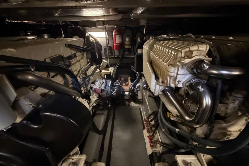 Slide: The Image of Engine room of a 2002 Sea Ray 480 Motor Yacht, showcasing dual engines and equipment. - 39