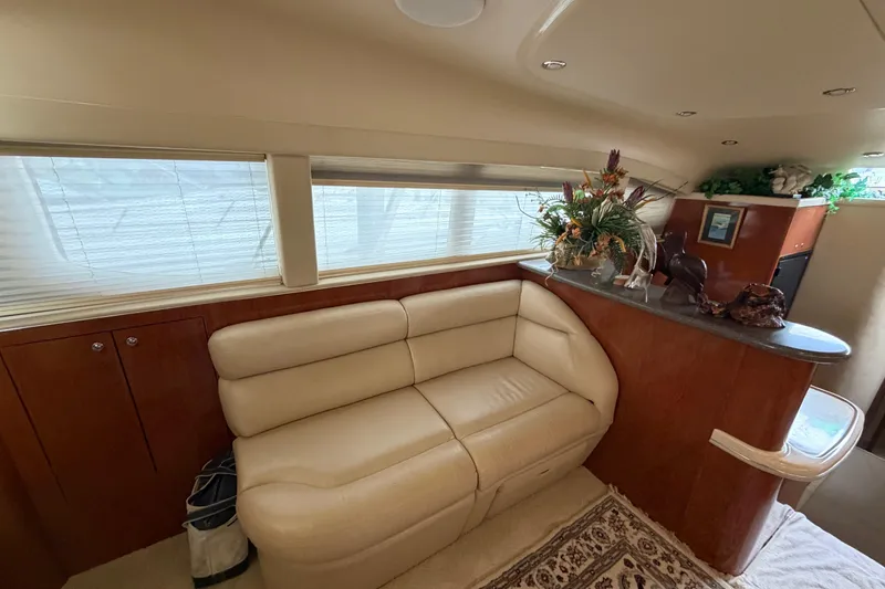 Slide: The Image of Luxurious interior of 2002 Sea Ray 480 Motor Yacht with leather seating and elegant decor. - 15