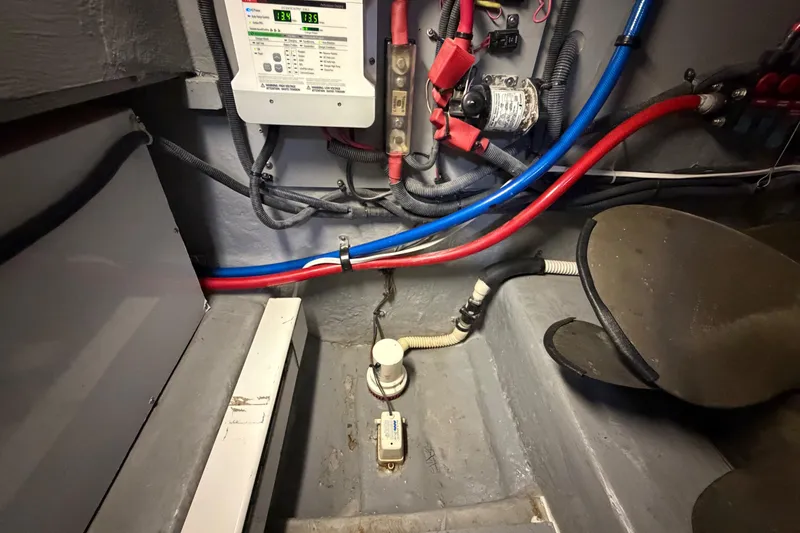 Slide: The Image of Engine room of 2002 Sea Ray 480 Motor Yacht with wiring and components visible. - 36