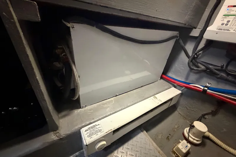 Slide: The Image of Engine room of 2002 Sea Ray 480 Motor Yacht with visible wiring and equipment. - 35