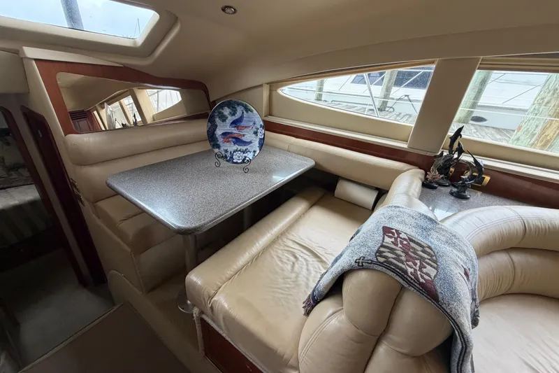 Slide: The Image of Luxurious interior of 2002 Sea Ray 480 Motor Yacht with elegant seating and decor. - 26