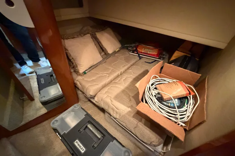 Slide: The Image of Interior cabin of 2002 Sea Ray 480 Motor Yacht with tools and cables. - 31