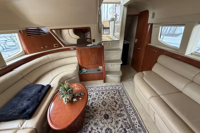 Slide: The Image of Luxurious interior of a 2002 Sea Ray 480 Motor Yacht with plush seating and elegant decor. - 16