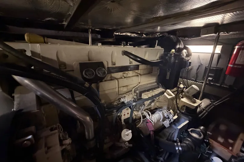 Slide: The Image of Engine room of a 2002 Sea Ray 480 Motor Yacht, showcasing mechanical components. - 48