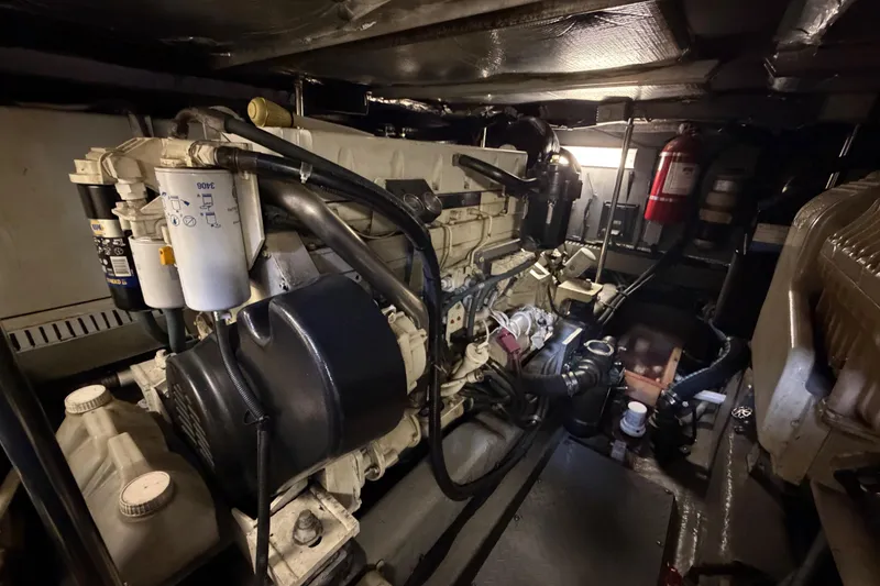 Slide: The Image of Engine room of a 2002 Sea Ray 480 Motor Yacht, showcasing mechanical components. - 41