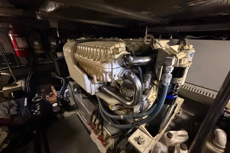 Slide: The Image of Engine room of a 2002 Sea Ray 480 Motor Yacht, showcasing mechanical components. - 40