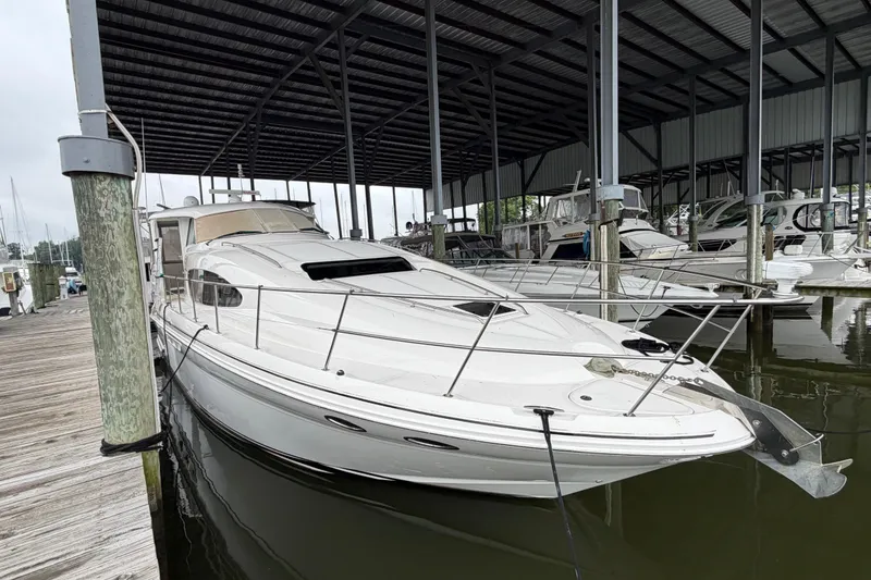 Slide: The Image of 2002 Sea Ray 480 Motor Yacht docked in a covered marina. - 3