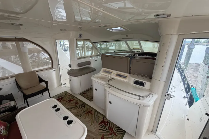 Slide: The Image of Interior of a 2002 Sea Ray 480 Motor Yacht with seating and helm station. - 4