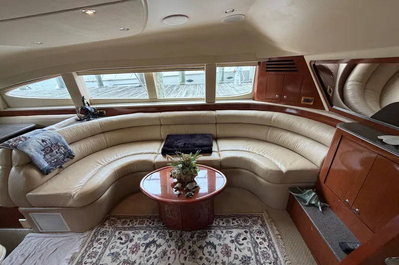 Slide: The Image of Luxurious interior of a 2002 Sea Ray 480 Motor Yacht with leather seating and elegant decor. - 17