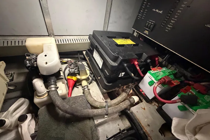 Slide: The Image of Engine room of a 2002 Sea Ray 480 Motor Yacht showing battery setup and wiring. - 43
